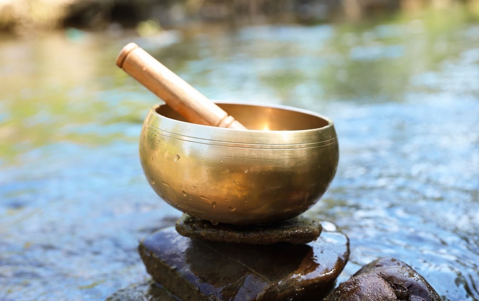 Tibetan bowl with prayer beads and candle