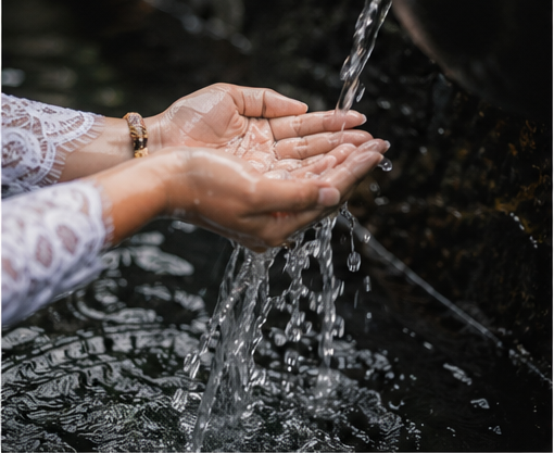 Hands touching water